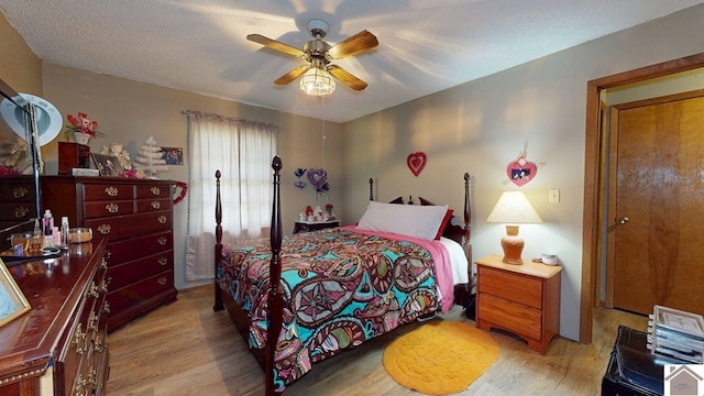 199 Park St, Gilbertsville, KY 42044 - bedroom with light wood-style floors and ceiling fan