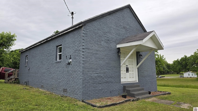 175 Jefferson, Cadiz, KY 42211 - view of side of home with entry steps, a lawn, crawl space, and brick siding
