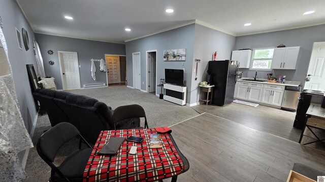 175 Jefferson, Cadiz, KY 42211 - living room featuring light wood-type flooring, recessed lighting, crown molding, a baseboard heating unit, and baseboards