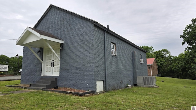 175 Jefferson, Cadiz, KY 42211 - view of side of property with entry steps, central AC, a lawn, and brick siding
