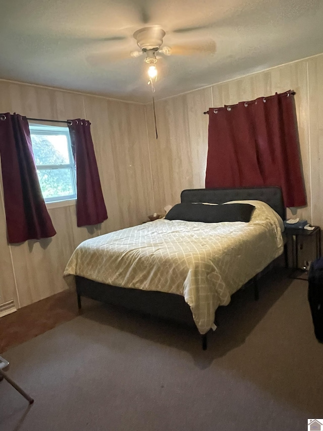 4924 State Route 121 S, Mayfield, KY 42066 - carpeted bedroom featuring wooden walls and ceiling fan