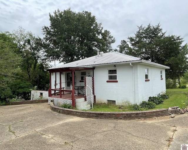 4924 State Route 121 S, Mayfield, KY 42066 - view of front facade featuring concrete block siding, covered porch, and metal roof