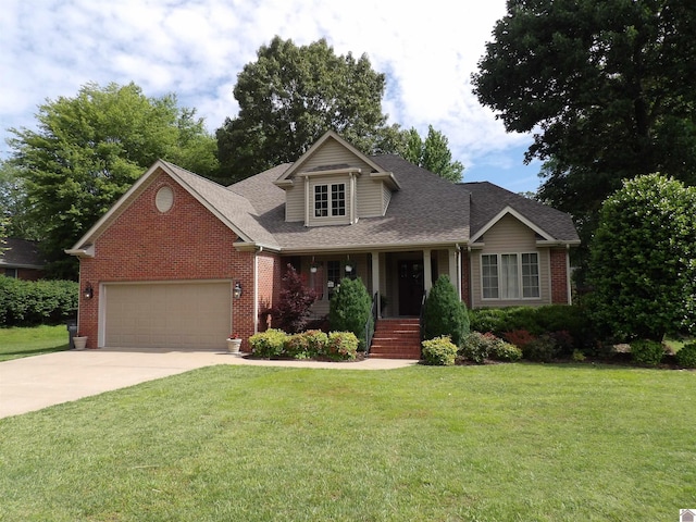 145 Stonecreek Pl, Paducah, KY 42003 - view of front of house featuring brick siding, a porch, driveway, a garage, and a front yard