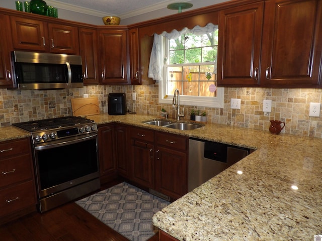 145 Stonecreek Pl, Paducah, KY 42003 - kitchen featuring stainless steel appliances, a sink, tasteful backsplash, light stone countertops, and ornamental molding