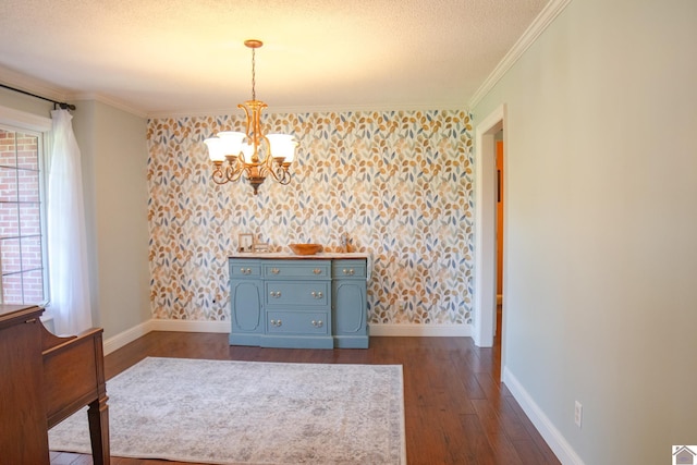 145 Stonecreek Pl, Paducah, KY 42003 - spare room with baseboards, a chandelier, dark wood-style flooring, plenty of natural light, and crown molding