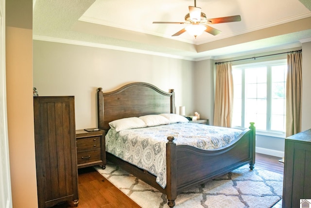 145 Stonecreek Pl, Paducah, KY 42003 - bedroom with a tray ceiling, wood finished floors, ornamental molding, and ceiling fan