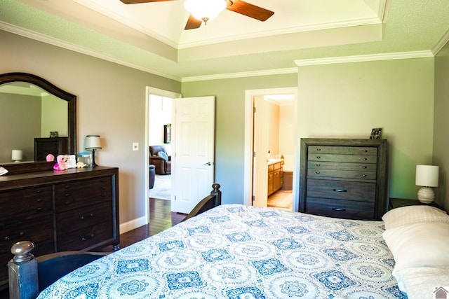 145 Stonecreek Pl, Paducah, KY 42003 - bedroom featuring a raised ceiling, wood finished floors, ornamental molding, ensuite bath, and baseboards