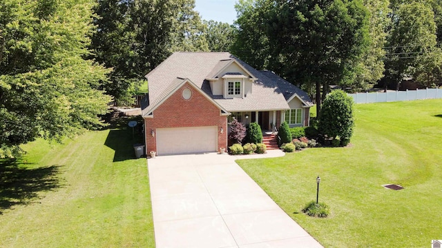 145 Stonecreek Pl, Paducah, KY 42003 - view of front of home with brick siding, concrete driveway, an attached garage, and covered porch
