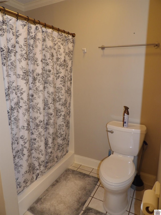 145 Stonecreek Pl, Paducah, KY 42003 - bathroom featuring crown molding, toilet, a shower with shower curtain, tile patterned flooring, and baseboards