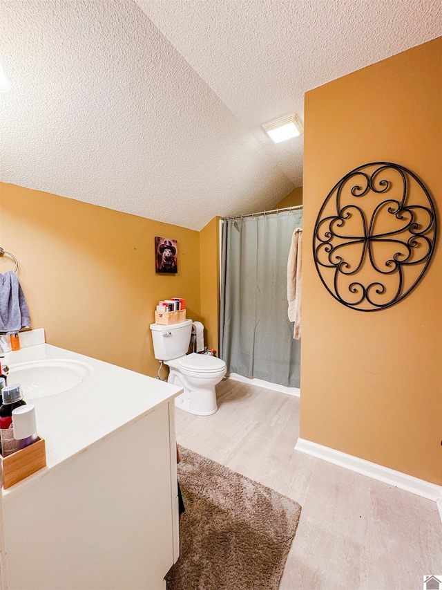 145 Stonecreek Pl, Paducah, KY 42003 - bathroom featuring a textured ceiling, vanity, toilet, vaulted ceiling, and a shower with curtain