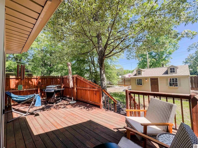 145 Stonecreek Pl, Paducah, KY 42003 - wooden terrace with grilling area, a fenced backyard, and an outbuilding