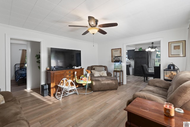 3730 Metropolis Lake Rd, West Paducah, KY 42086 - living area featuring ceiling fan, crown molding, and wood finished floors
