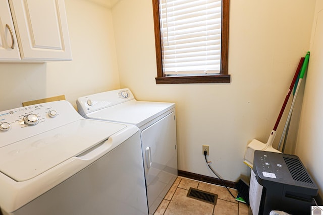 251 Hickory Hill Ln, Benton, KY 42025 - washroom with cabinet space, washing machine and clothes dryer, light tile patterned floors, and baseboards