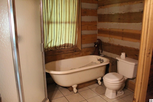 2365 Weldon Rd, Marion, KY 42064 - full bath featuring a freestanding tub, tile patterned floors, toilet, and wood walls