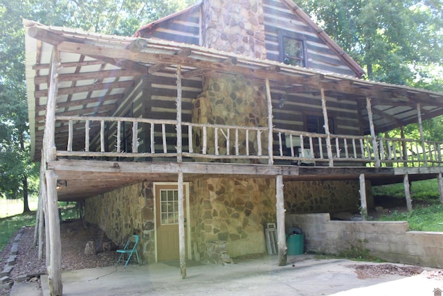 2365 Weldon Rd, Marion, KY 42064 - rear view of house with stone siding and a deck
