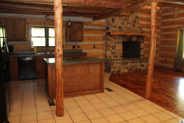 2365 Weldon Rd, Marion, KY 42064 - kitchen with black appliances, dark countertops, beamed ceiling, a sink, and a center island