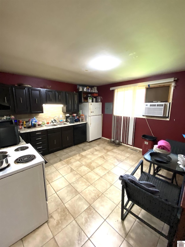 2222 Harrison St, Paducah, KY 42001 - kitchen with white appliances, dark cabinets, light countertops, a sink, and cooling unit