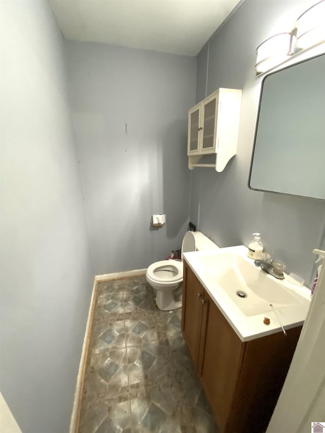 2222 Harrison St, Paducah, KY 42001 - half bath featuring vanity, toilet, and baseboards