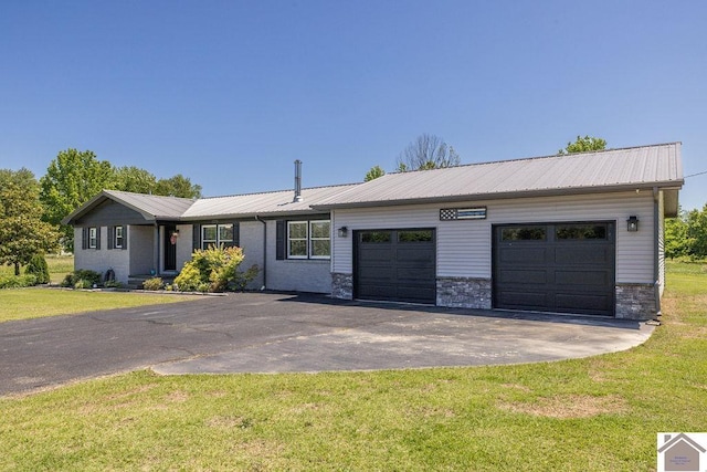 1379 Dunaway Ln, Boaz, KY 42027 - ranch-style house with asphalt driveway, an attached garage, stone siding, metal roof, and a front yard