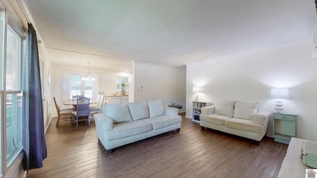 1916 Monroe St, Paducah, KY 42001 - living area with dark wood finished floors, a chandelier, and baseboards