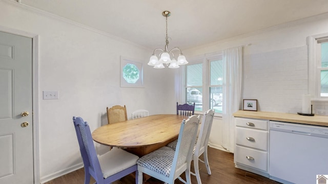 1916 Monroe St, Paducah, KY 42001 - dining area featuring dark wood-style floors, a chandelier, crown molding, and plenty of natural light