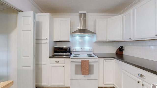 1916 Monroe St, Paducah, KY 42001 - kitchen featuring white range with electric cooktop, wall chimney exhaust hood, stainless steel microwave, dark countertops, and ornamental molding