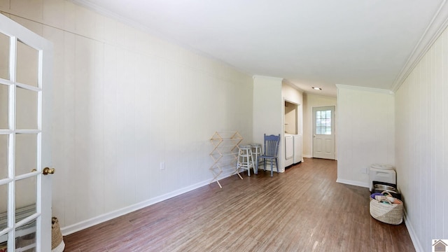 1916 Monroe St, Paducah, KY 42001 - unfurnished room featuring wood finished floors, ornamental molding, baseboards, and washer / clothes dryer