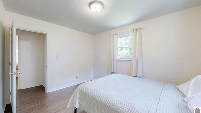 1916 Monroe St, Paducah, KY 42001 - bedroom featuring wood finished floors and baseboards