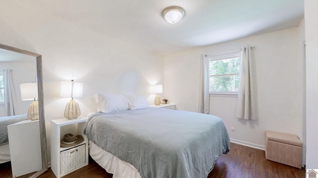 1916 Monroe St, Paducah, KY 42001 - bedroom featuring dark wood-style floors, radiator heating unit, and baseboards