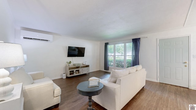 1916 Monroe St, Paducah, KY 42001 - living area featuring a wall mounted air conditioner, wood finished floors, and baseboards