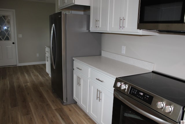 1400 Walnut St, Benton, KY 42025 - kitchen featuring stainless steel appliances, wood finished floors, white cabinetry, and light countertops