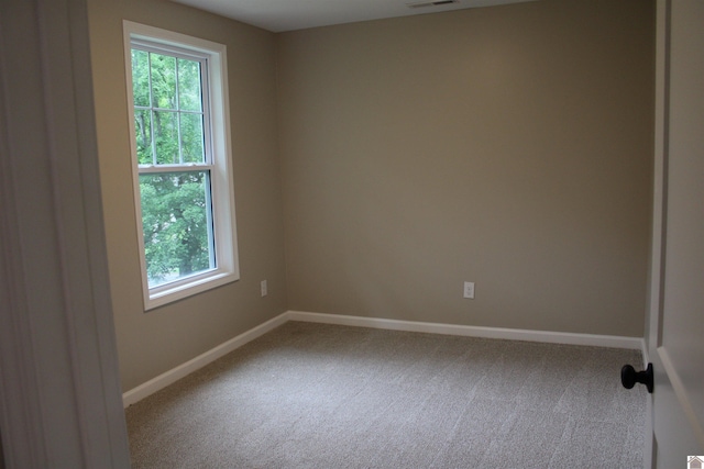 1400 Walnut St, Benton, KY 42025 - carpeted spare room featuring healthy amount of natural light and baseboards