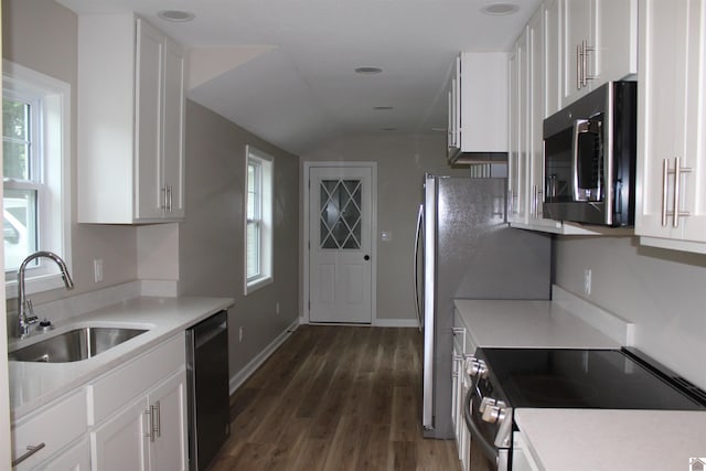 1400 Walnut St, Benton, KY 42025 - kitchen with stainless steel microwave, electric stove, a sink, dishwashing machine, and white cabinetry