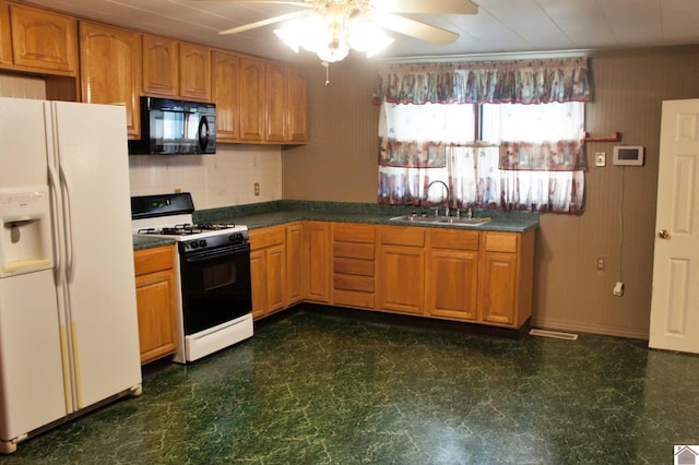 909 S 3rd St, Paducah, KY 42003 - kitchen featuring black microwave, gas range oven, white refrigerator with ice dispenser, a sink, and a ceiling fan