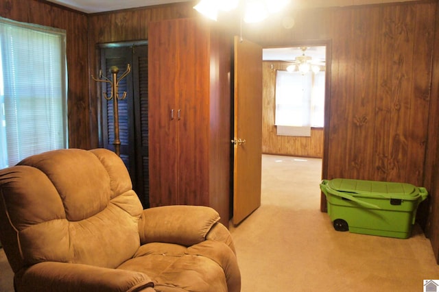 909 S 3rd St, Paducah, KY 42003 - sitting room featuring carpet, wooden walls, and a ceiling fan