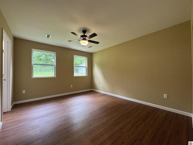 110 Dawson Rd, Princeton, KY 42445 - spare room featuring dark wood finished floors, ceiling fan, and baseboards
