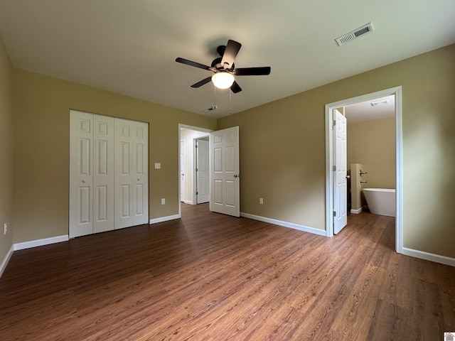 110 Dawson Rd, Princeton, KY 42445 - unfurnished bedroom with wood finished floors, a closet, baseboards, and ensuite bath