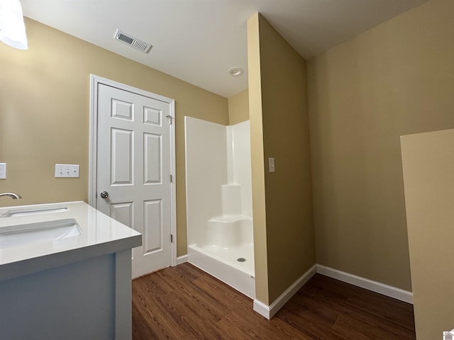 110 Dawson Rd, Princeton, KY 42445 - bathroom with wood finished floors, walk in shower, baseboards, and double vanity