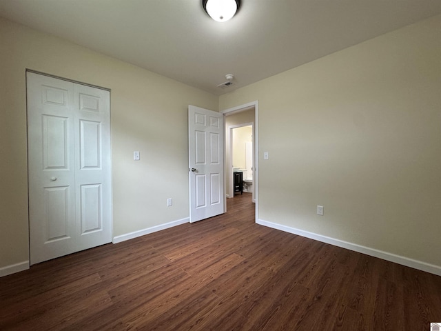 110 Dawson Rd, Princeton, KY 42445 - unfurnished bedroom with dark wood-style floors and baseboards