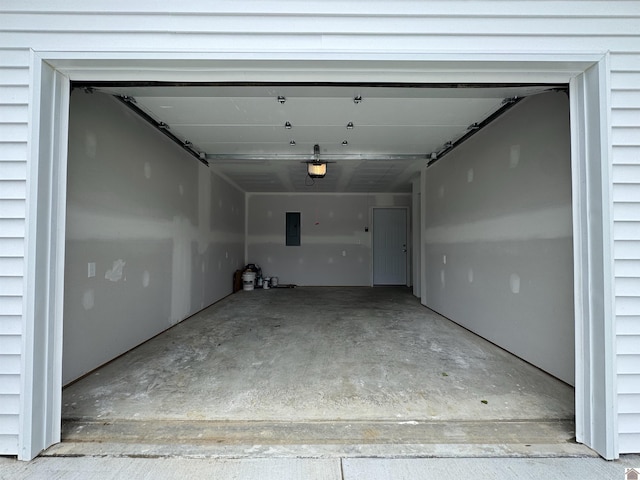 110 Dawson Rd, Princeton, KY 42445 - garage with electric panel and a garage door opener