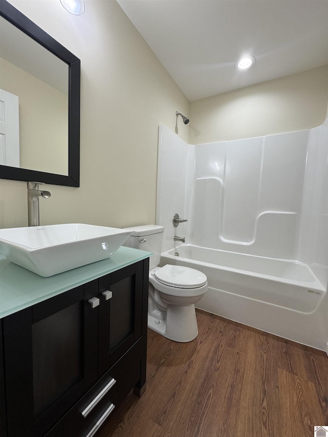110 Dawson Rd, Princeton, KY 42445 - bathroom with wood finished floors, toilet, vanity, shower / tub combination, and recessed lighting