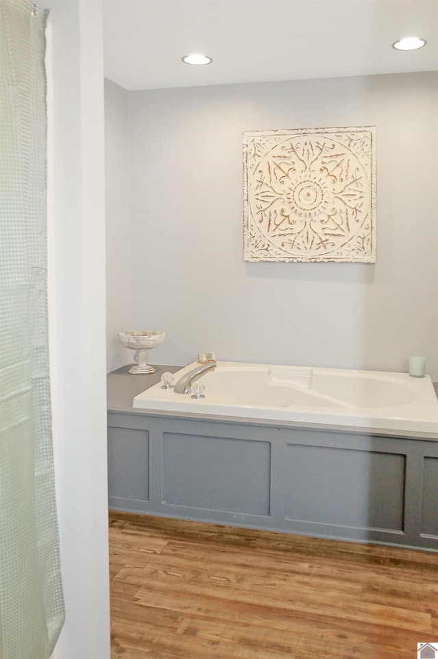 756 Utterback, Murray, KY 42071 - bathroom with wood finished floors, a bath, recessed lighting, and a shower with shower curtain