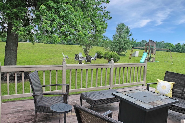 756 Utterback, Murray, KY 42071 - wooden terrace featuring a fire pit, a lawn, and a playground