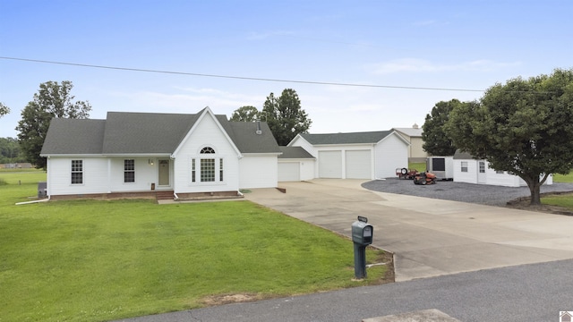 99 Jacey Blake Dr, Calvert City, KY 42029 - view of front of home featuring a garage and a front yard