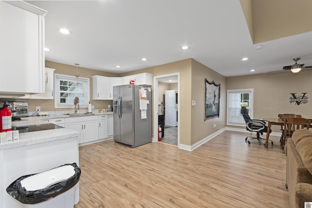 99 Jacey Blake Dr, Calvert City, KY 42029 - kitchen featuring stainless steel refrigerator with ice dispenser, a sink, plenty of natural light, light wood-type flooring, and recessed lighting
