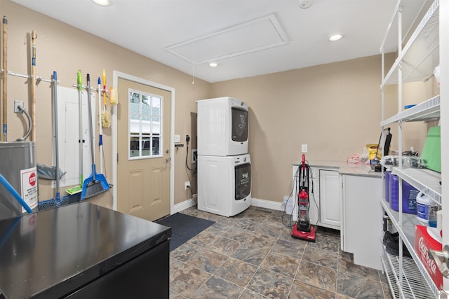99 Jacey Blake Dr, Calvert City, KY 42029 - kitchen featuring stacked washer / dryer, baseboards, light countertops, white cabinetry, and recessed lighting
