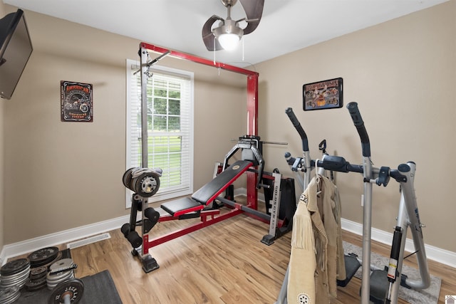 99 Jacey Blake Dr, Calvert City, KY 42029 - workout room featuring wood finished floors, ceiling fan, and baseboards