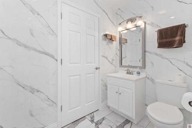 99 Jacey Blake Dr, Calvert City, KY 42029 - bathroom with marble look tiles, vanity, and toilet