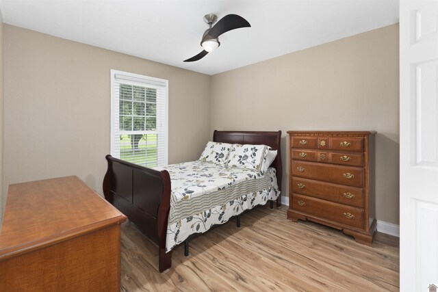 99 Jacey Blake Dr, Calvert City, KY 42029 - bedroom with light wood-style floors, baseboards, and ceiling fan