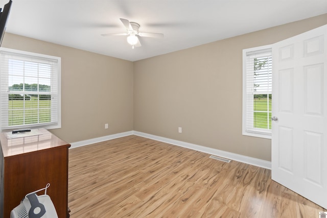 99 Jacey Blake Dr, Calvert City, KY 42029 - spare room featuring light wood-style floors, a ceiling fan, healthy amount of natural light, and baseboards